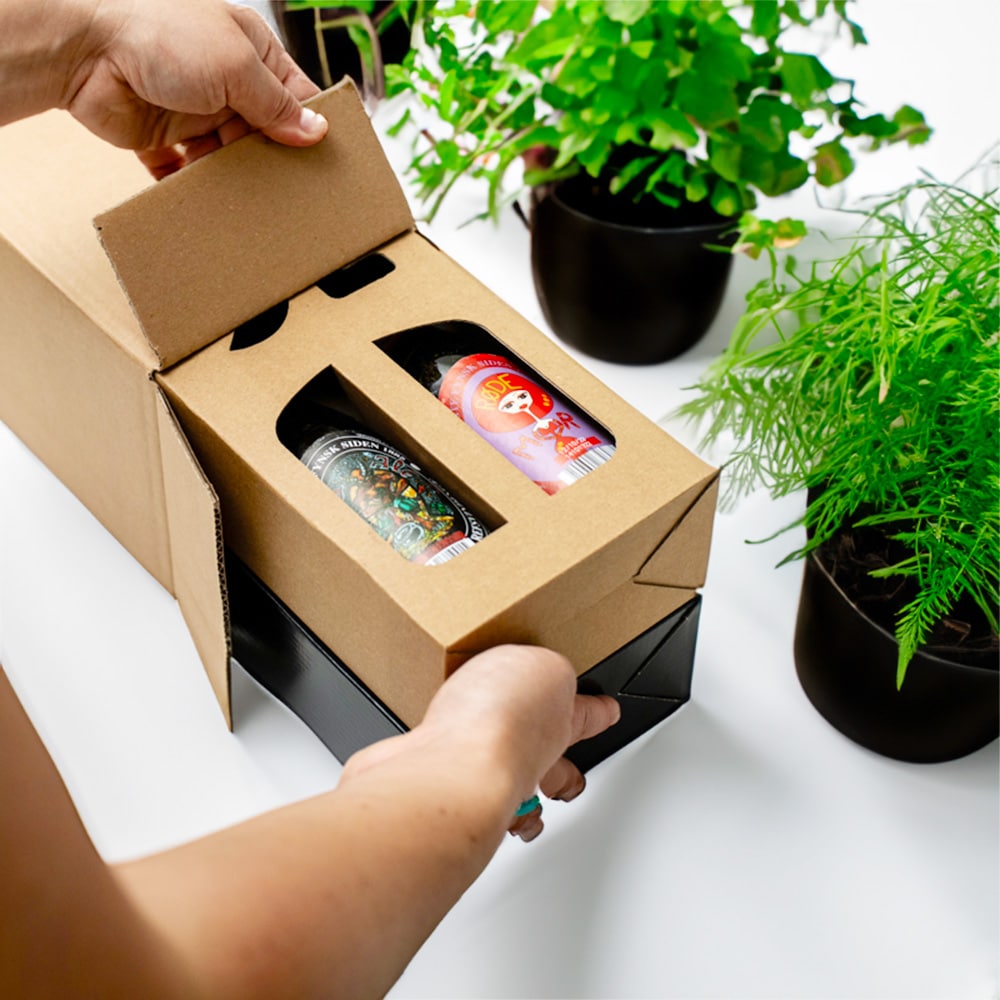 Standard cardboard box being packaged with beer